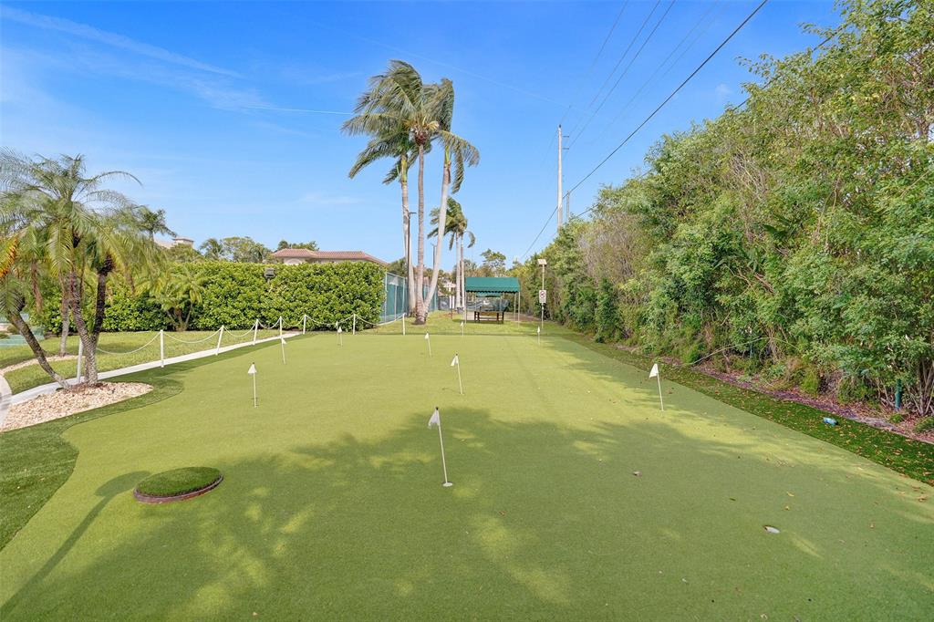 13 Royal Palm Way, Unit 5050 Boca Raton, FL 33432 - Photo 29 of 31 a swimming pool with an outdoor space and seating area