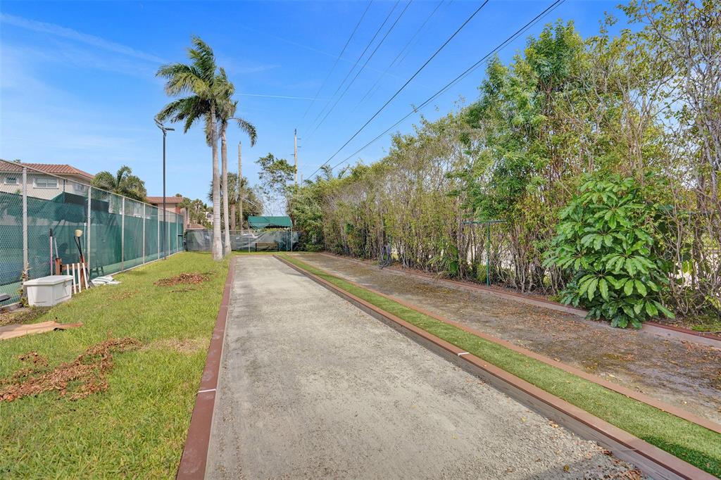 13 Royal Palm Way, Unit 5050 Boca Raton, FL 33432 - Photo 30 of 31 a view of a yard with palm tree