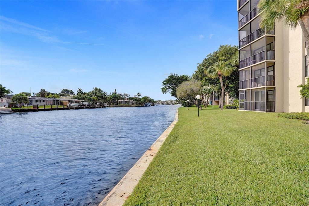 13 Royal Palm Way, Unit 5050 Boca Raton, FL 33432 - Photo 6 of 31 a view of a lake with a building in the background