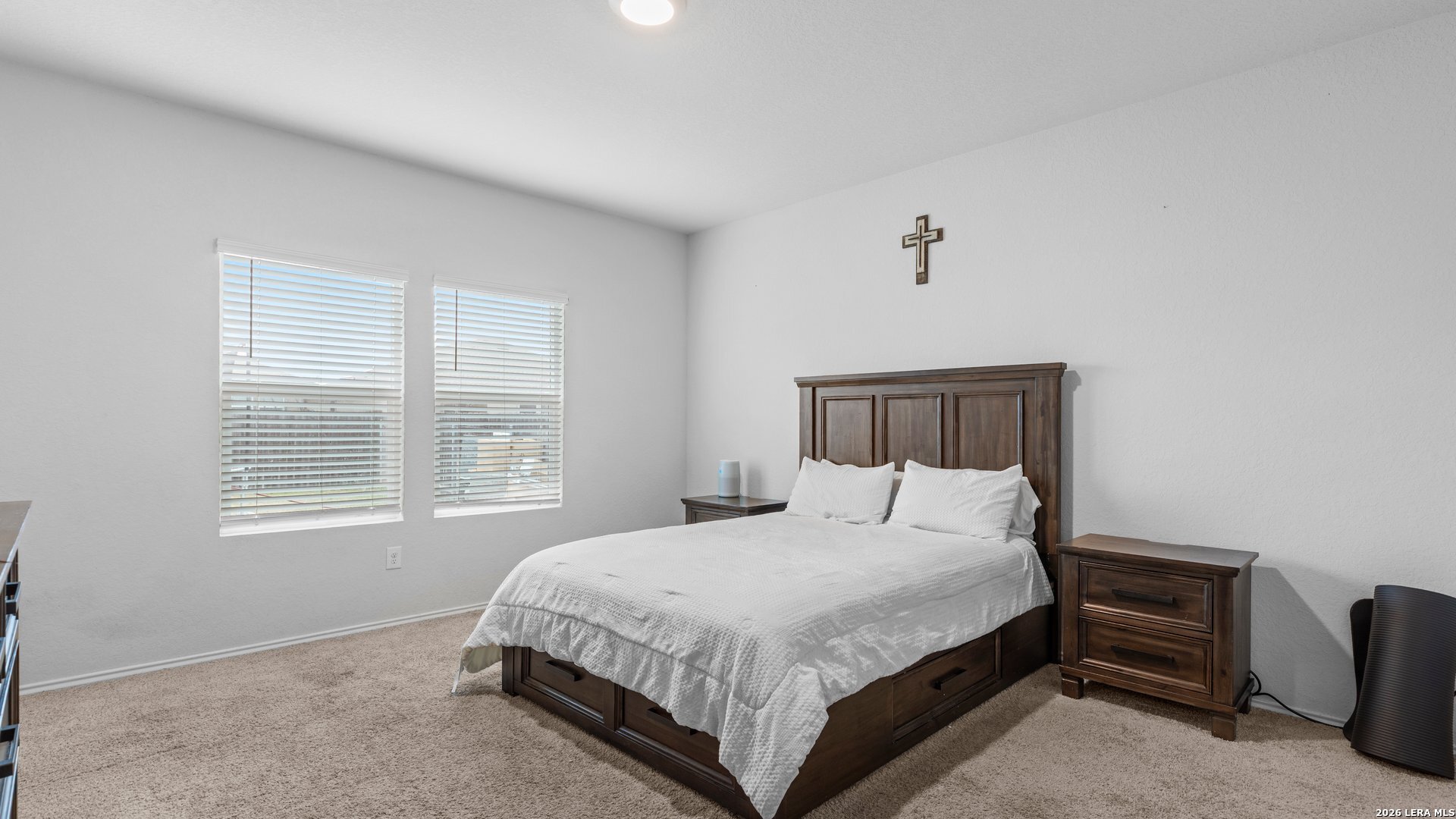 731 Monarch Drive Seguin, TX 78155 - Photo 12 of 21 a bedroom with a bed dresser and a window