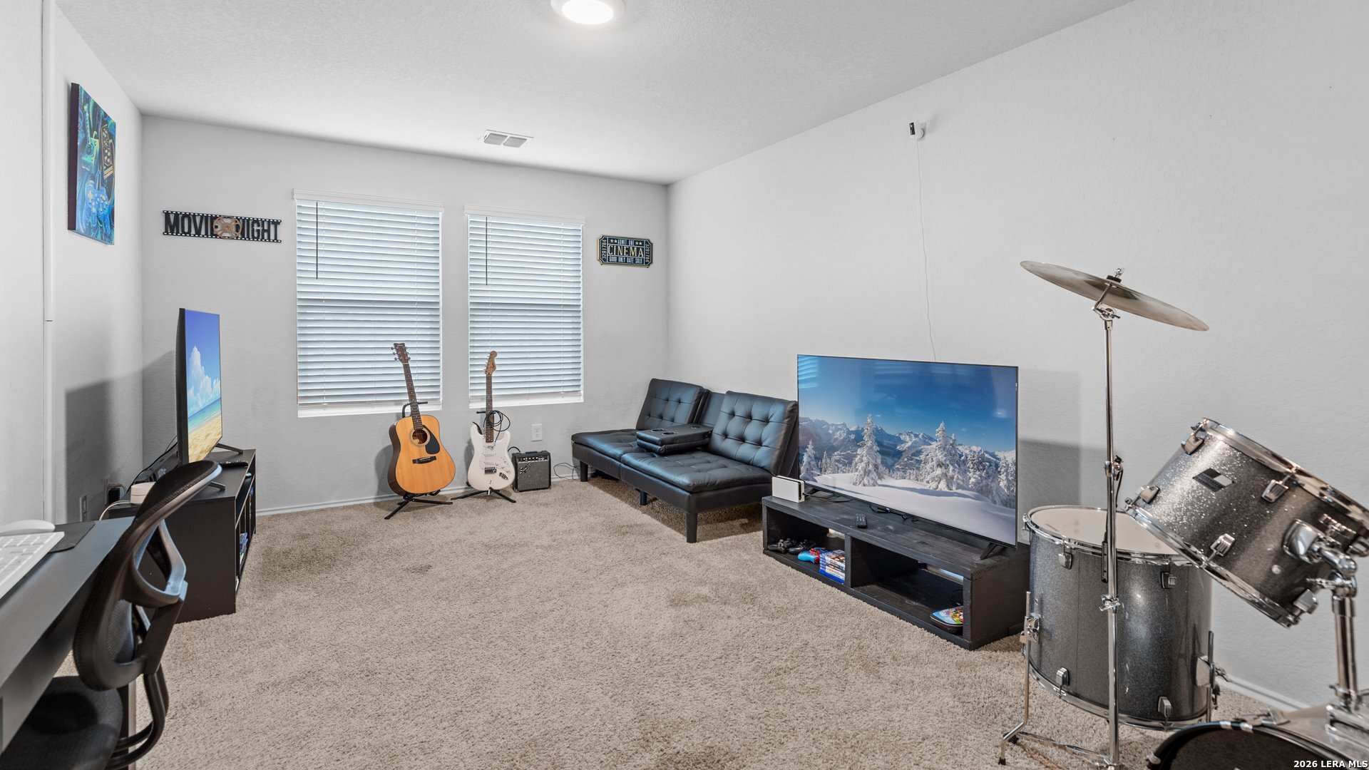 731 Monarch Drive Seguin, TX 78155 - Photo 13 of 21 a living room with furniture and a flat screen tv