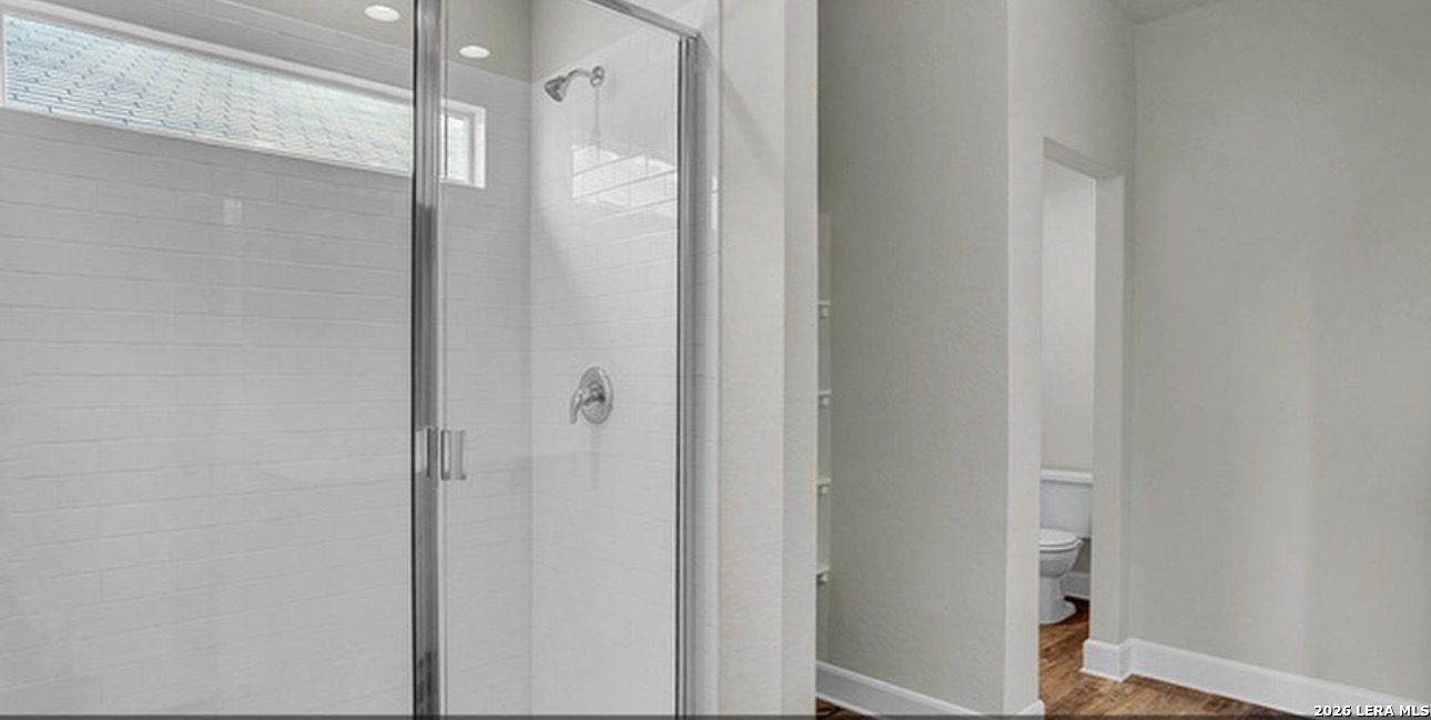 731 Monarch Drive Seguin, TX 78155 - Photo 8 of 21 a bathroom with a glass shower door