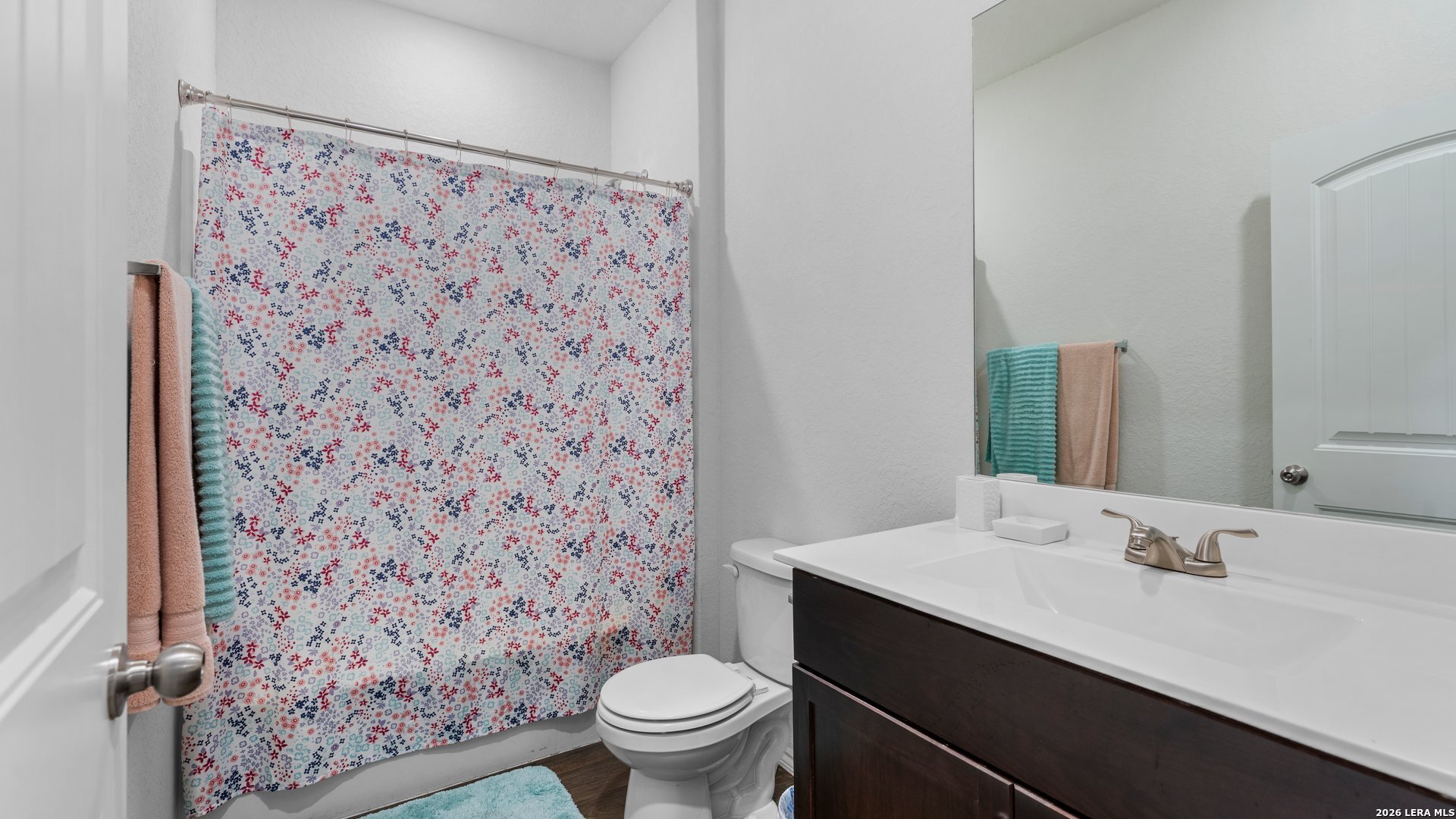 731 Monarch Drive Seguin, TX 78155 - Photo 10 of 21 a bathroom with a sink toilet and mirror