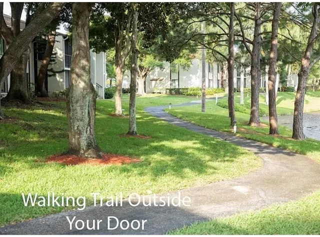 a view of a glass door with a yard