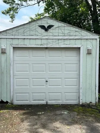 a kitchen with kitchen island granite countertop a stove a sink and a microwave