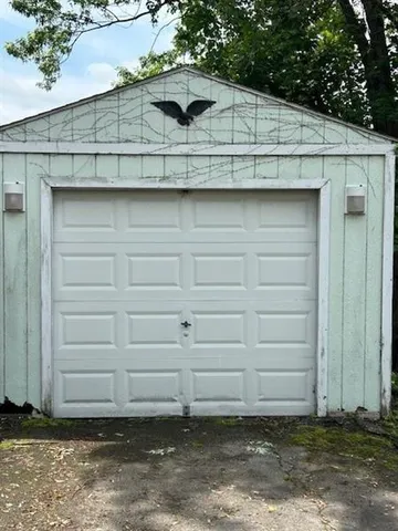 a kitchen with kitchen island granite countertop a stove a sink and a microwave