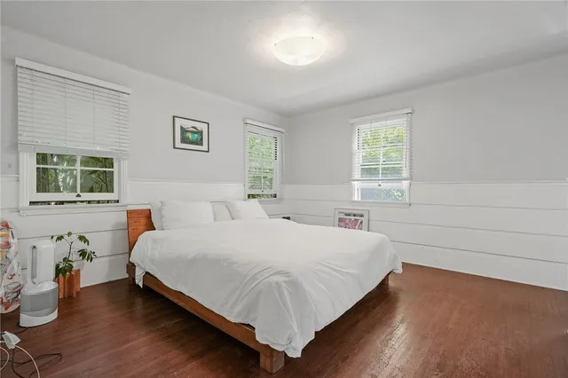 a large white bed in a white room