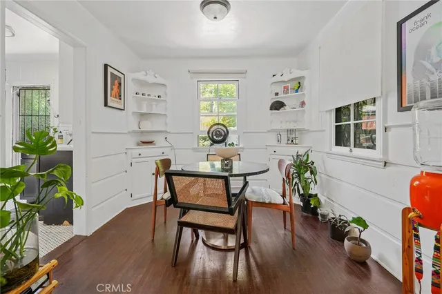 a view of a dining room with furniture and window