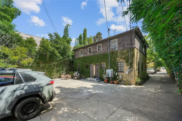 a view of a car park in front of a house