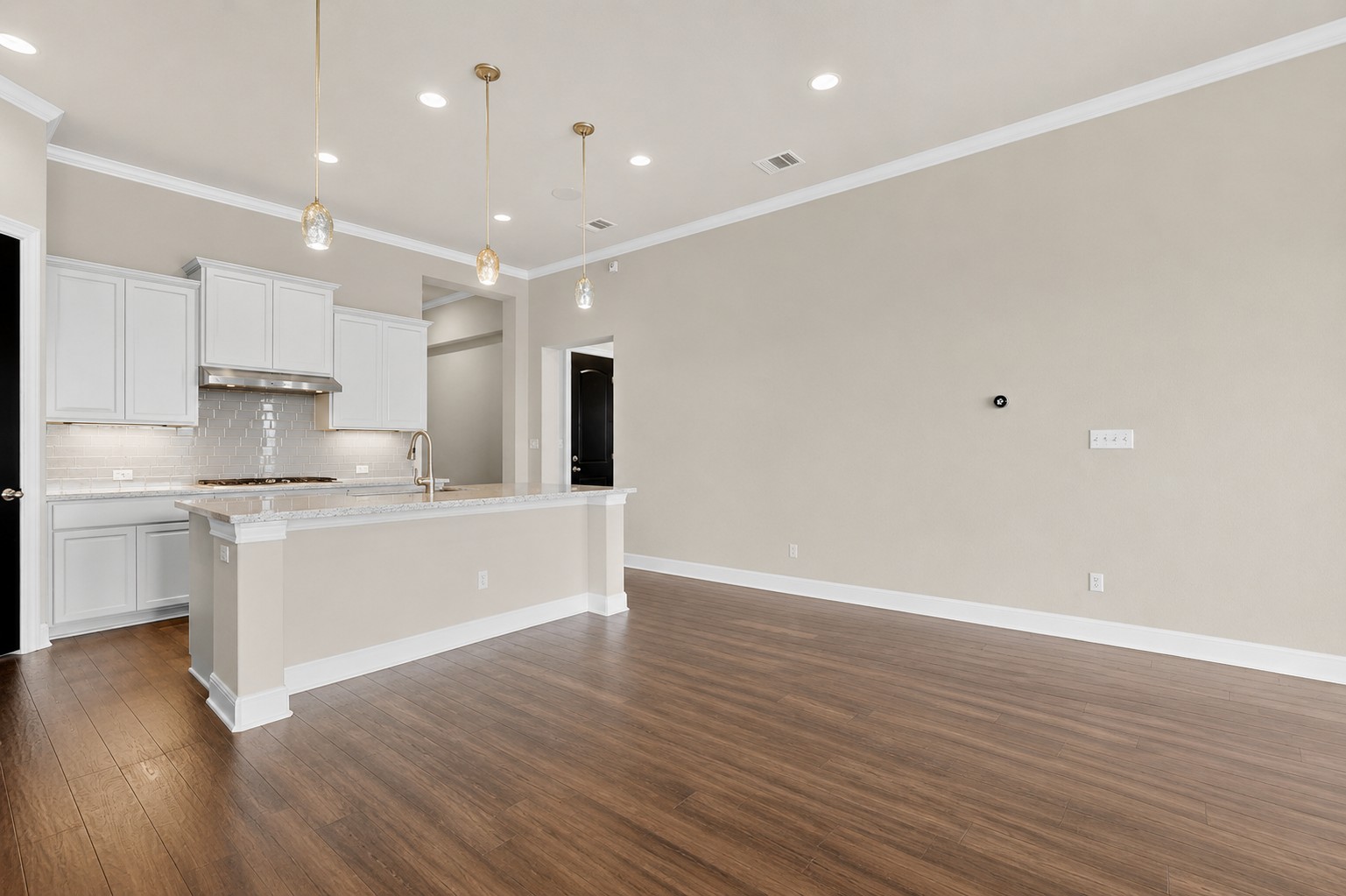 2617 Milan Meadows Drive Leander, TX 78641 - Photo 40 of 40 A well-appointed kitchen with an open floorplan flows into a spacious living area.