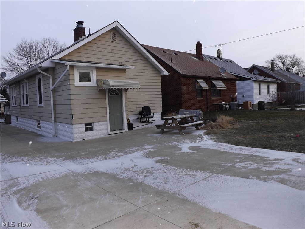3325 Ralph Avenue Cleveland, OH 44109 - Photo 14 of 14 extra wide driveway with patio around back of house