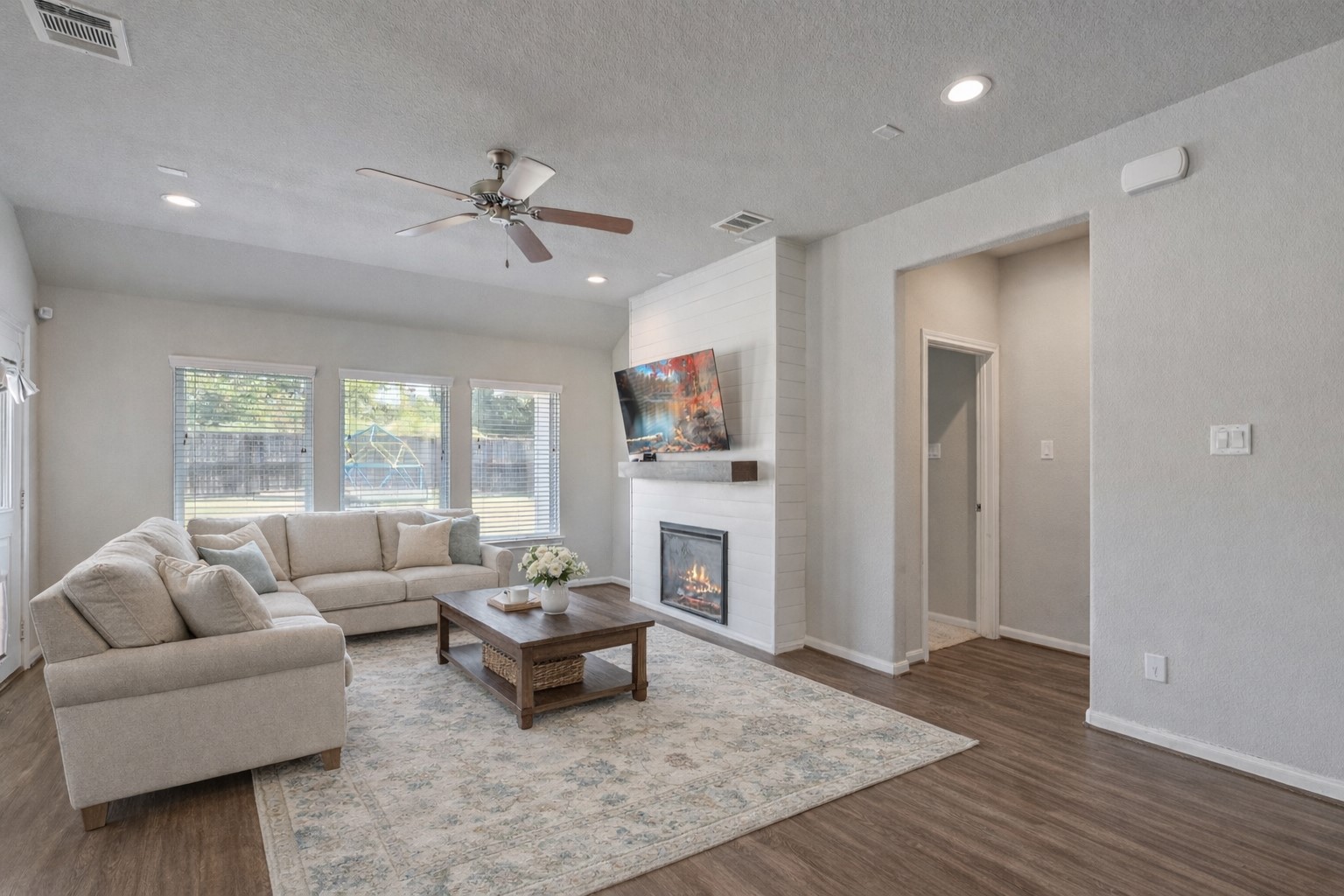 2328 Hagerman Road Conroe, TX 77384 - Photo 13 of 45 a living room with furniture and a fireplace