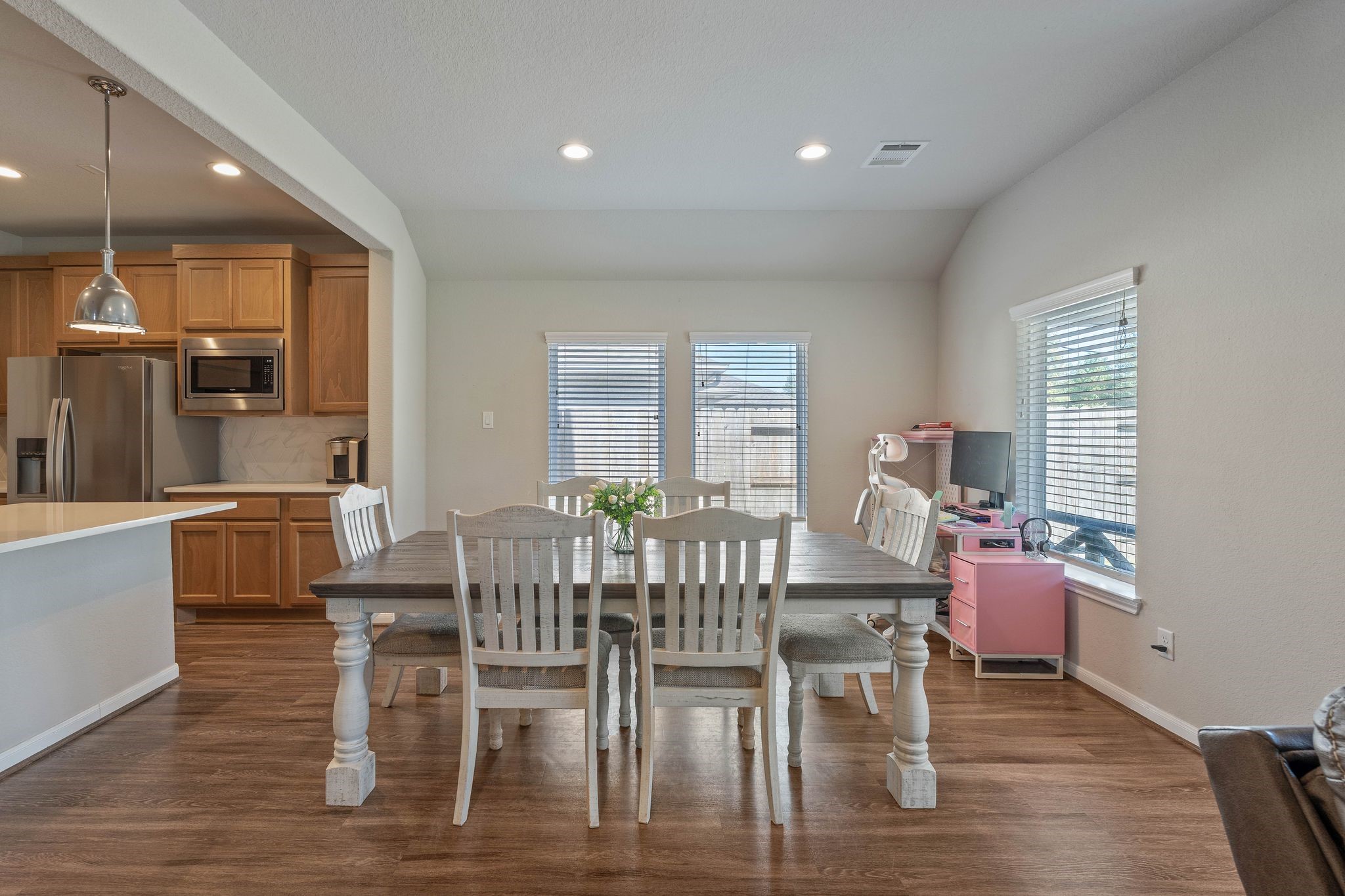 2328 Hagerman Road Conroe, TX 77384 - Photo 17 of 45 a view of a dining room with furniture and wooden floor