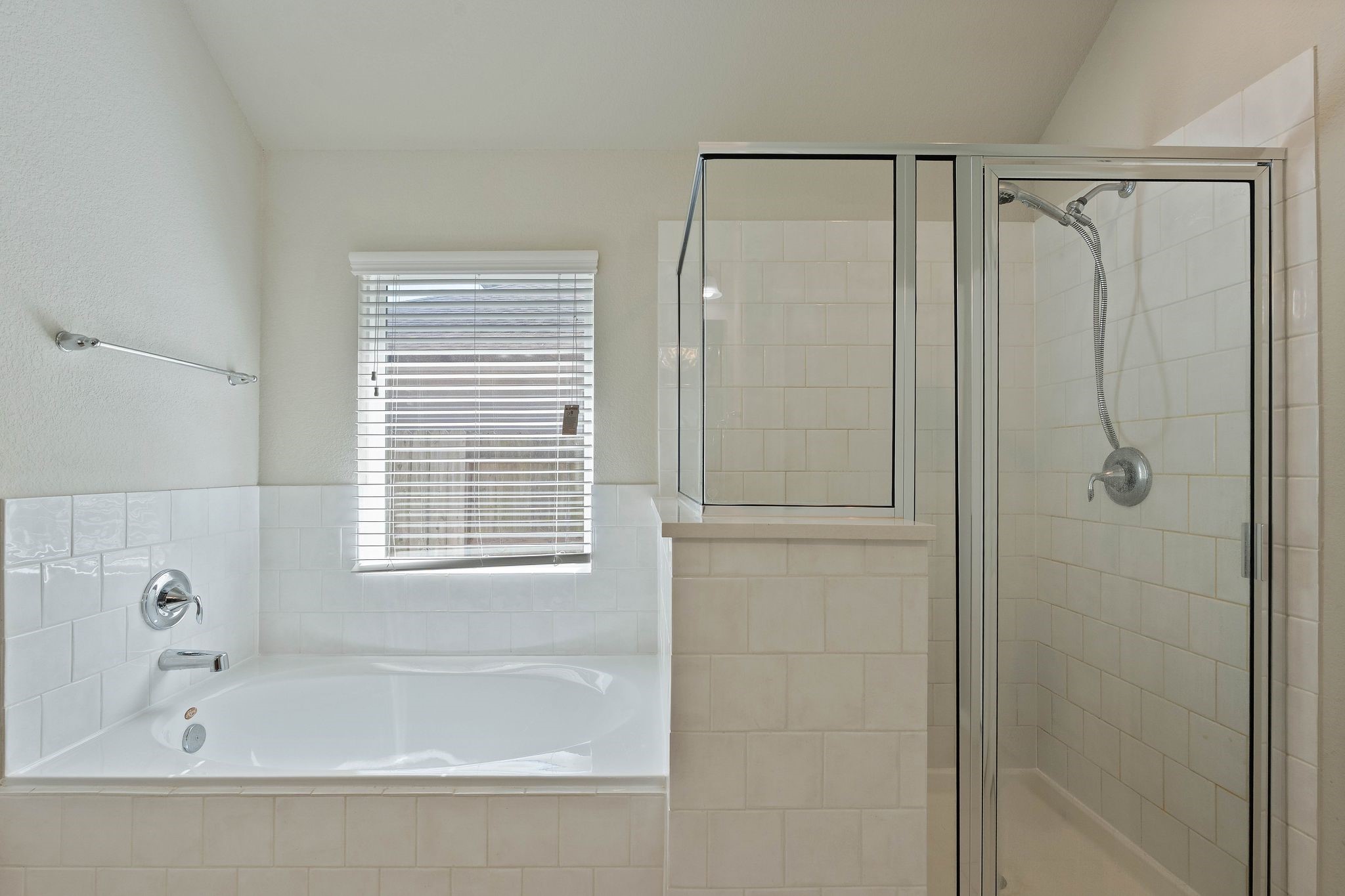 2328 Hagerman Road Conroe, TX 77384 - Photo 26 of 45 a bathroom with a bathtub and a shower