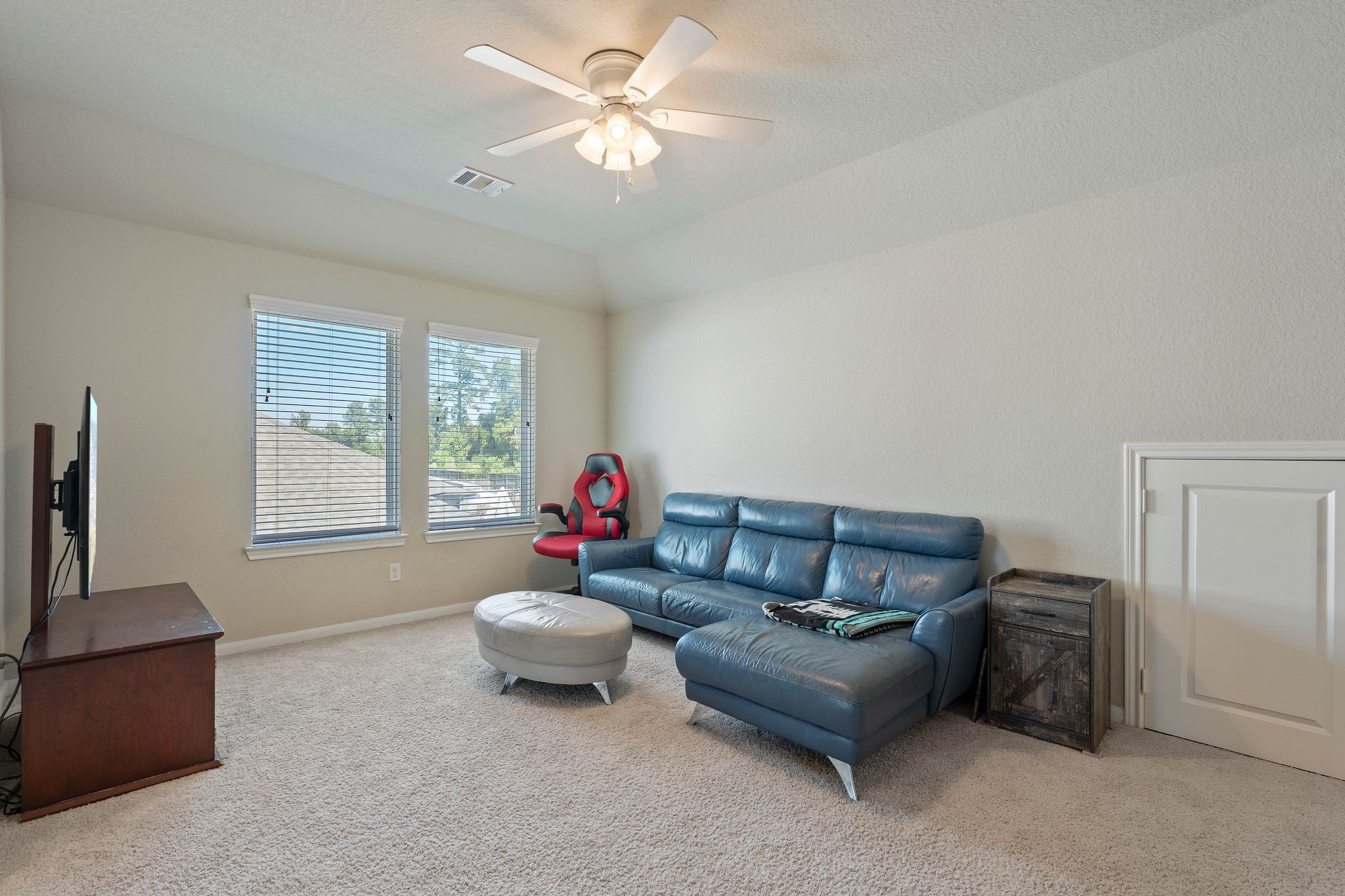 2328 Hagerman Road Conroe, TX 77384 - Photo 30 of 45 a living room with furniture and a window