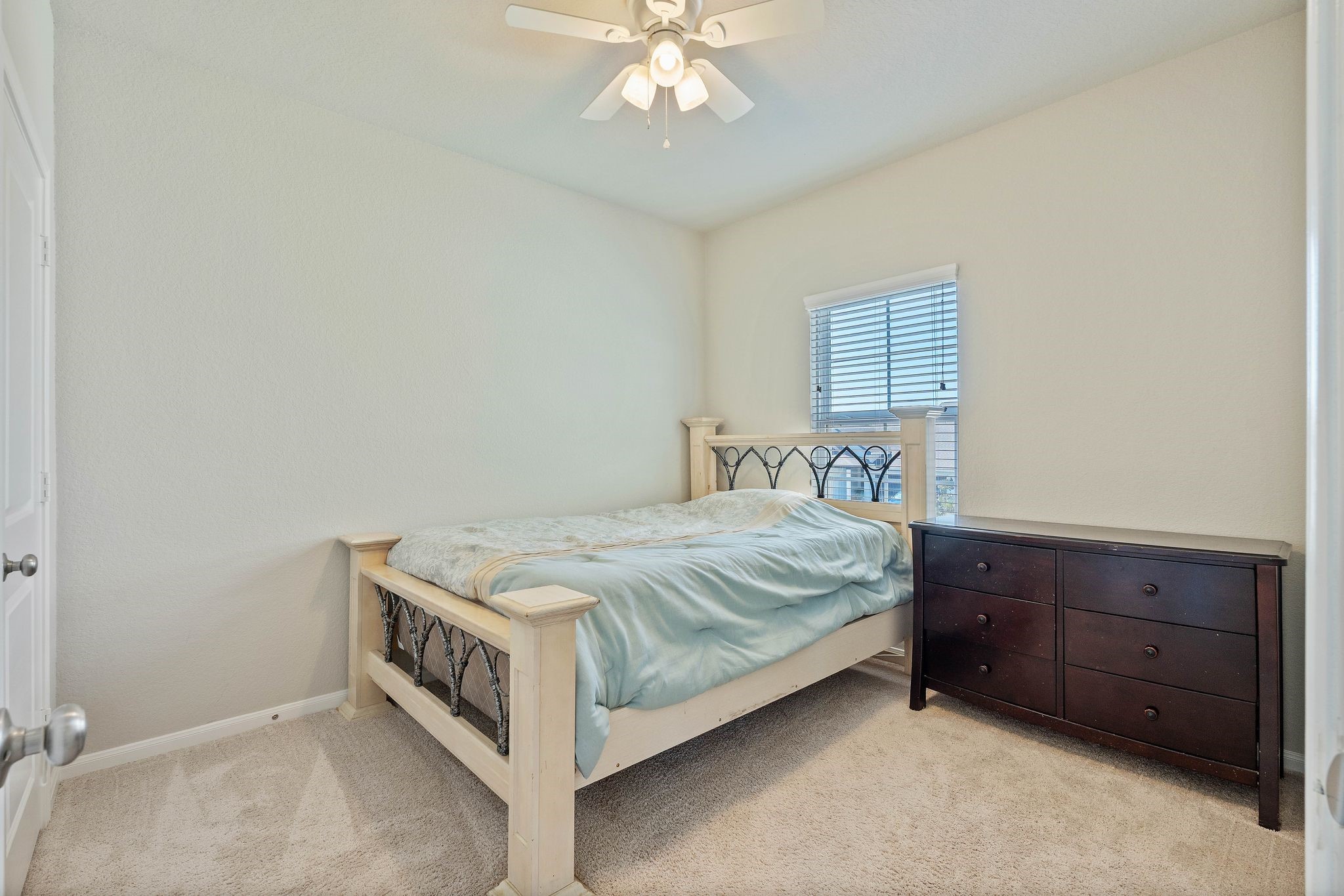 2328 Hagerman Road Conroe, TX 77384 - Photo 32 of 45 a spacious bedroom with a bed and a table