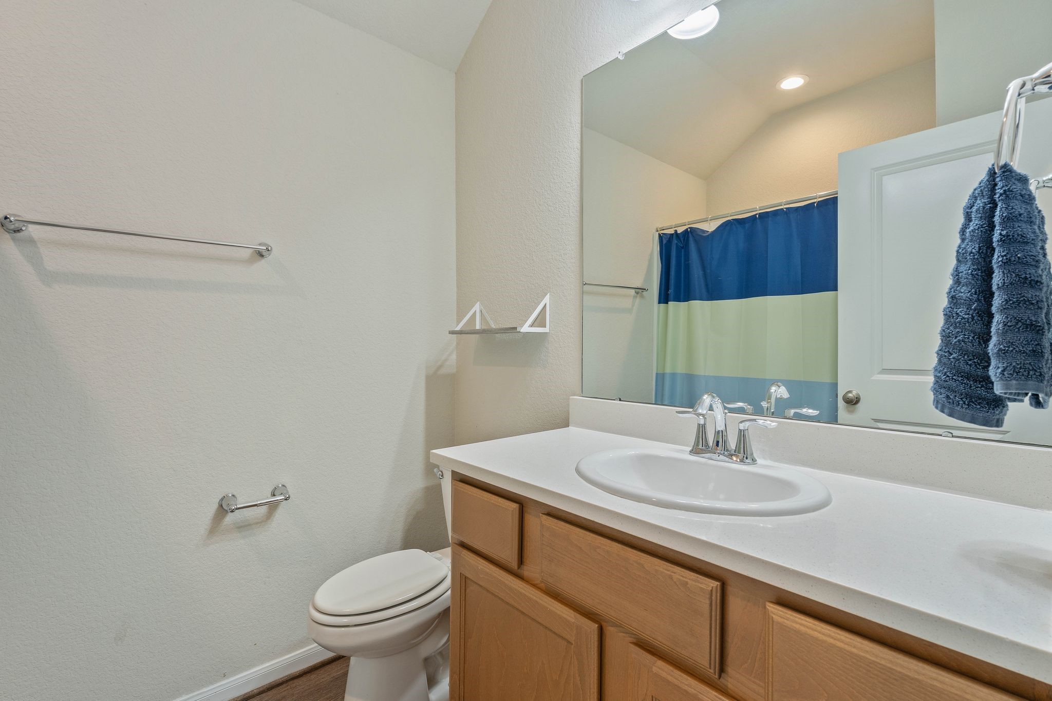 2328 Hagerman Road Conroe, TX 77384 - Photo 33 of 45 a bathroom with a sink toilet and a mirror