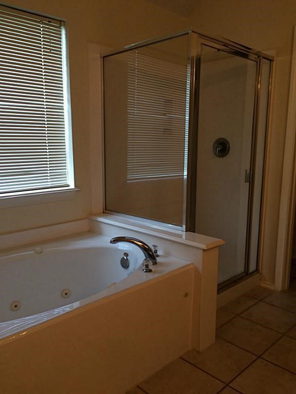 2527 Liza Court Spring, TX 77388 - Photo 21 of 23 a bath tub sitting next to a shower