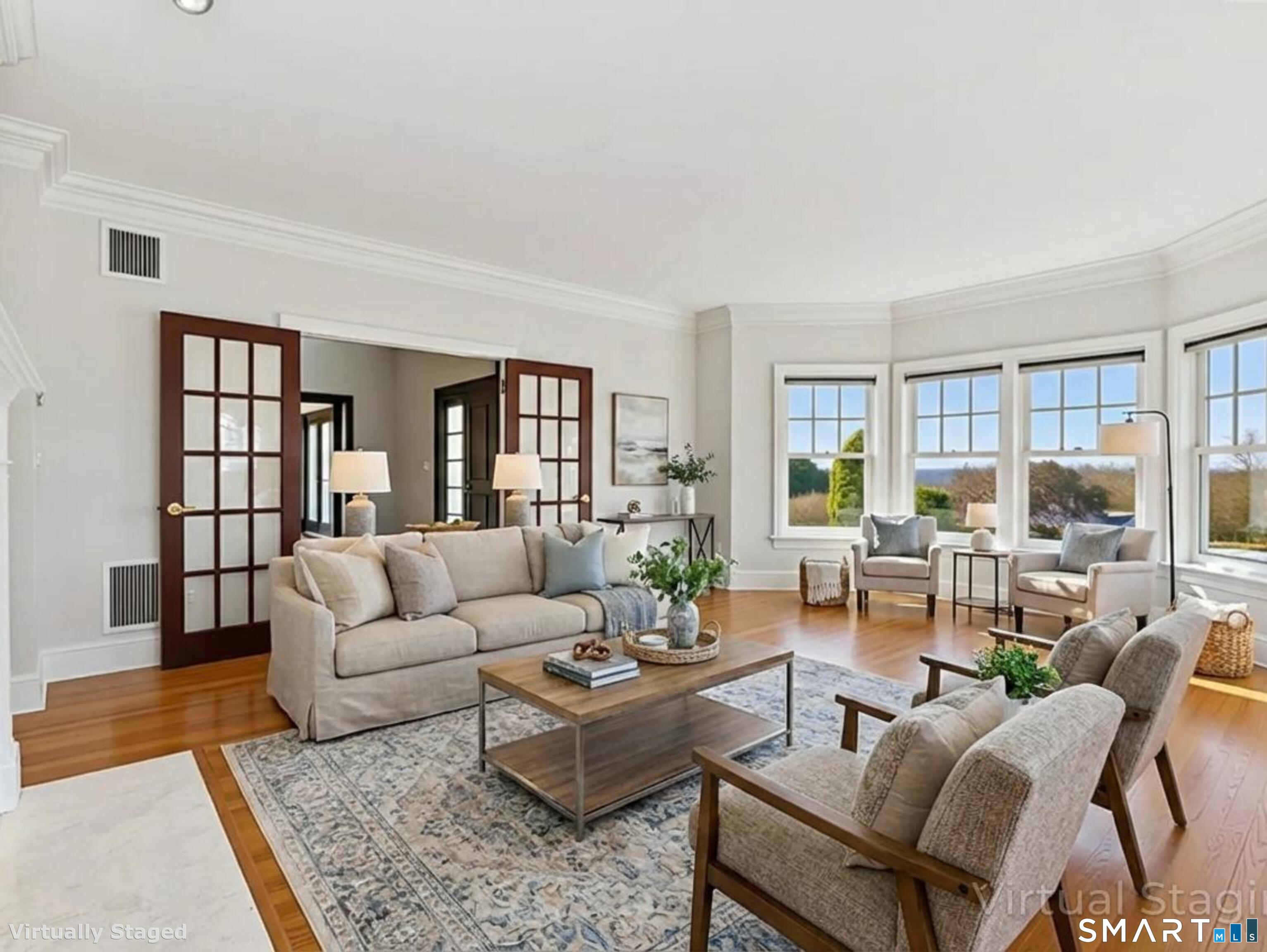 7 Long Meadow Lane Redding, CT 06896 - Photo 11 of 38 a living room with furniture and a wooden floor