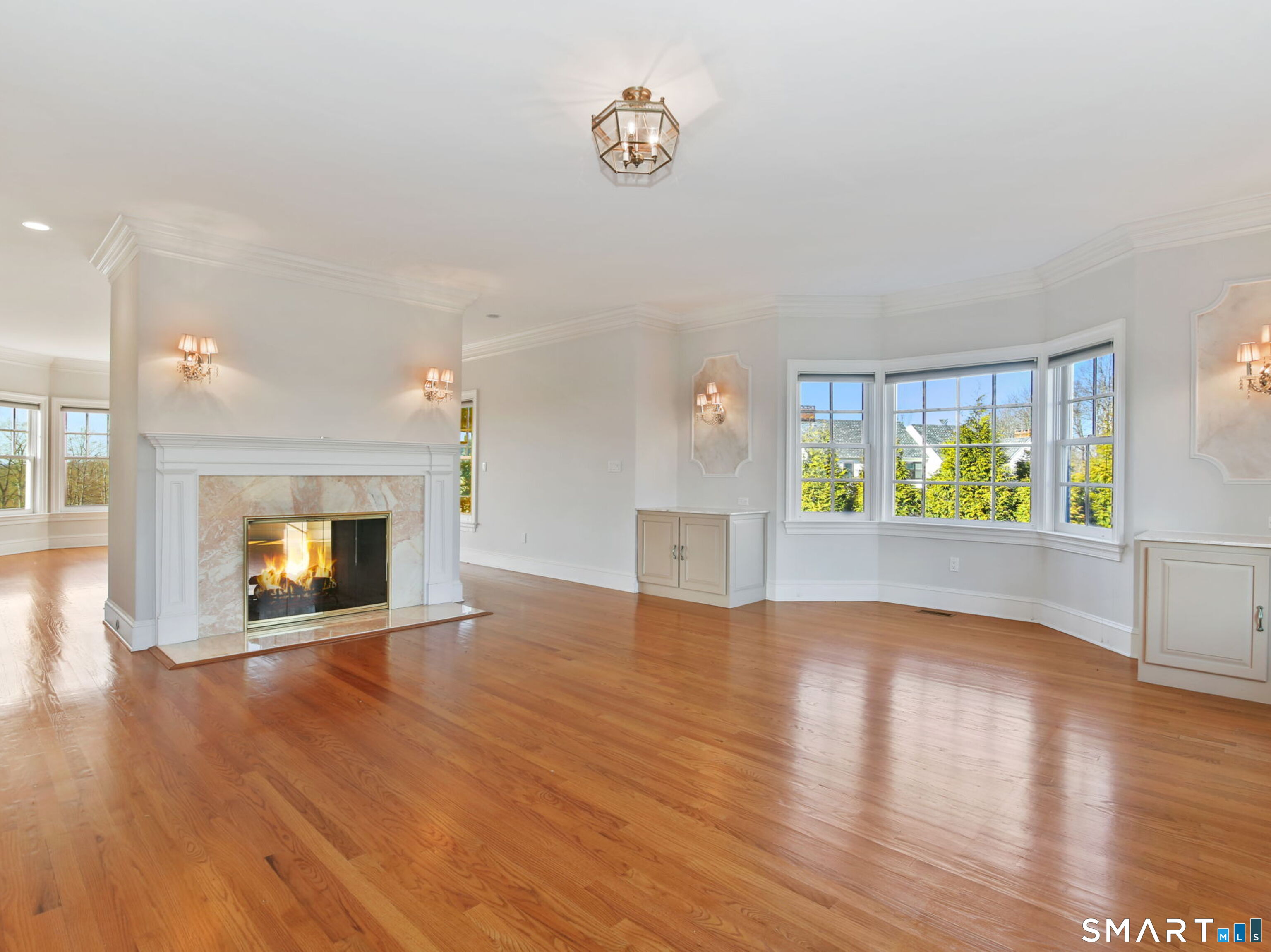 7 Long Meadow Lane Redding, CT 06896 - Photo 13 of 38 wooden floor in an empty room with a window