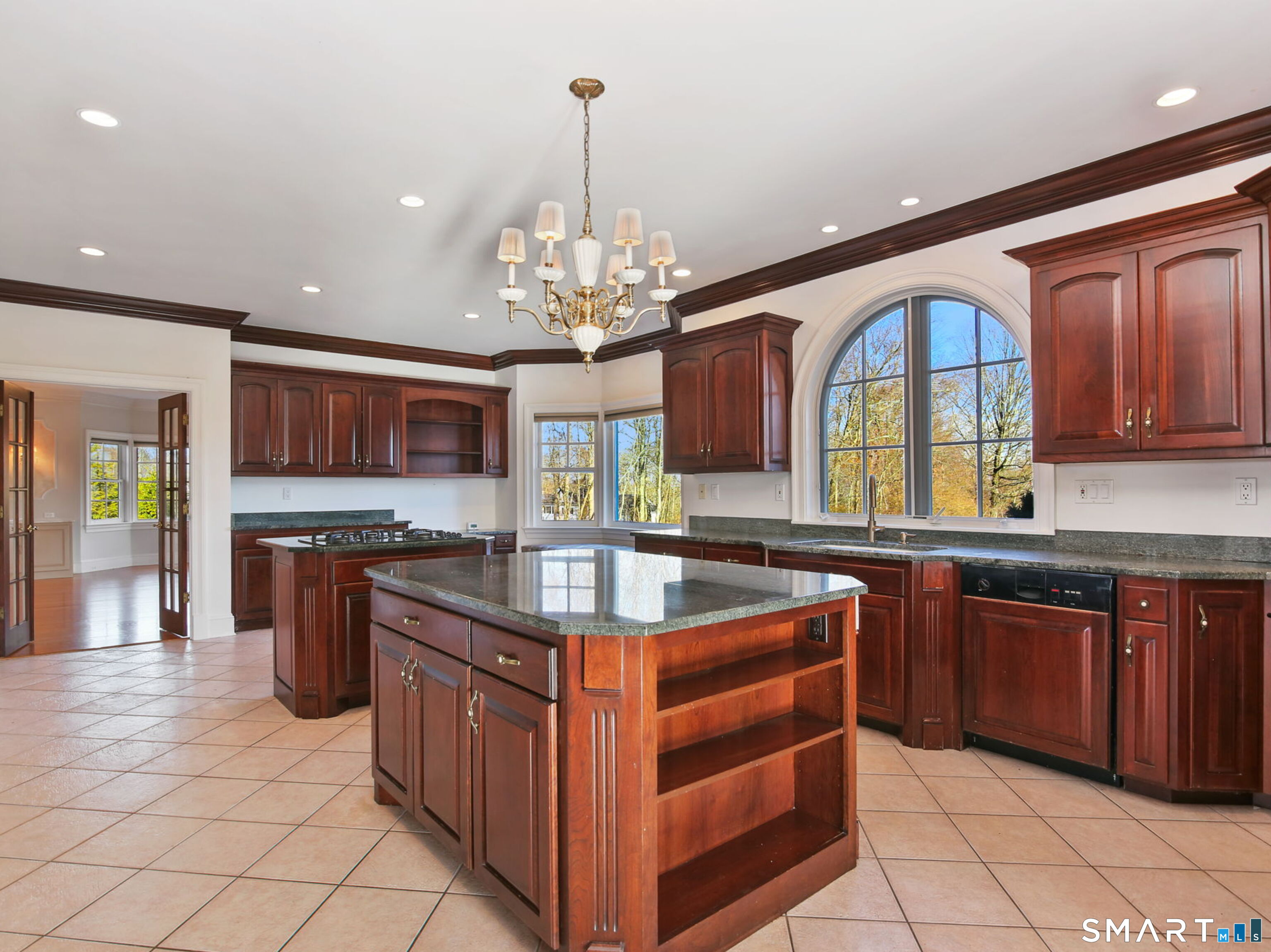 7 Long Meadow Lane Redding, CT 06896 - Photo 16 of 38 a kitchen with stainless steel appliances granite countertop a sink and a stove