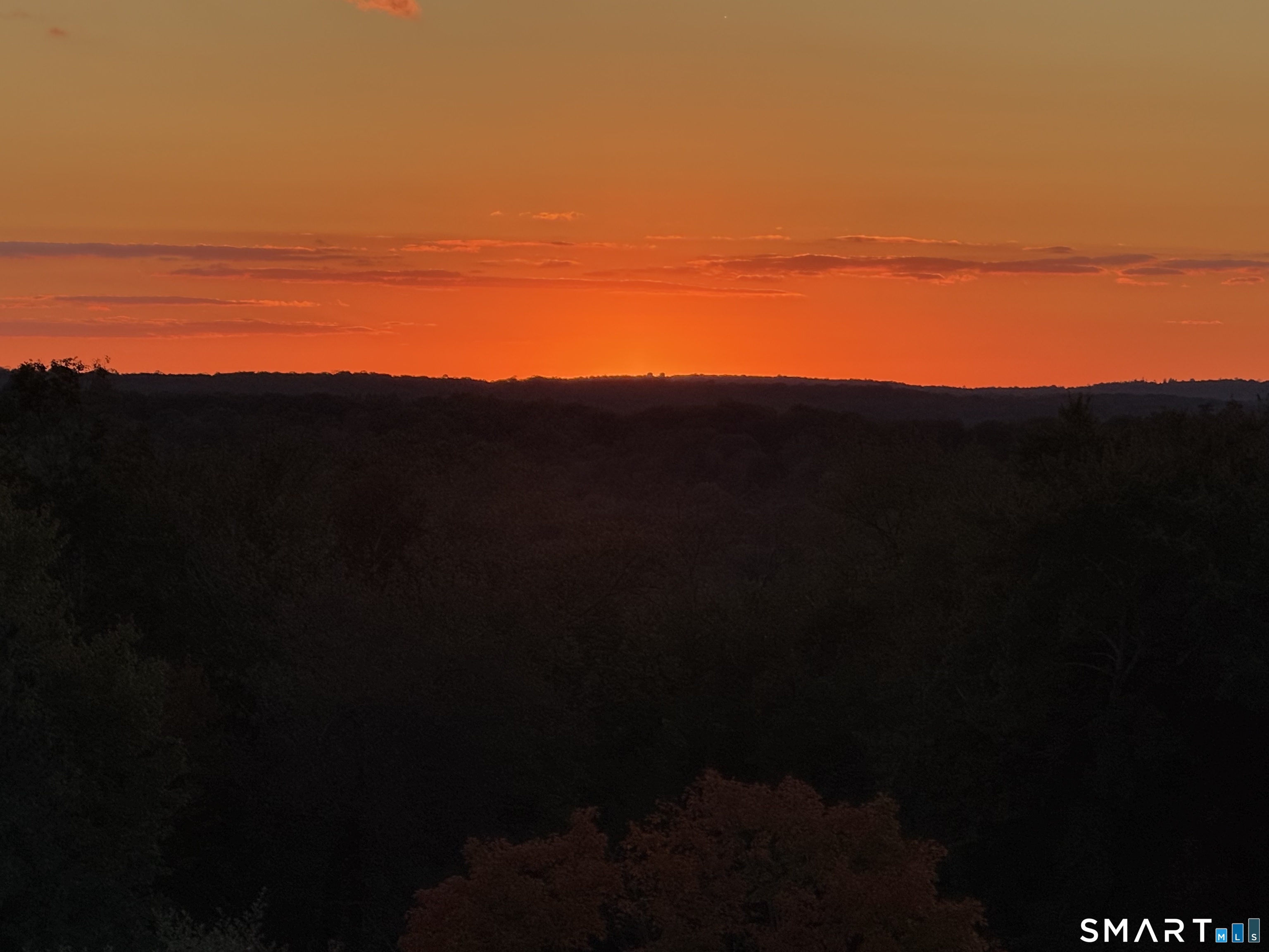 7 Long Meadow Lane Redding, CT 06896 - Photo 16 of 38 Golden hour unfolding across rolling treetops and open sky