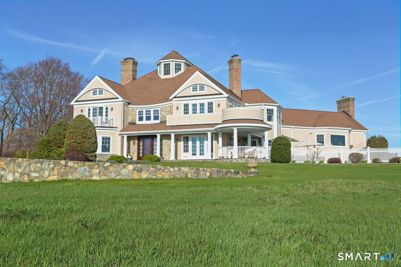 7 Long Meadow Lane Redding, CT 06896 - Photo 2 of 38 a front view of a house with a garden