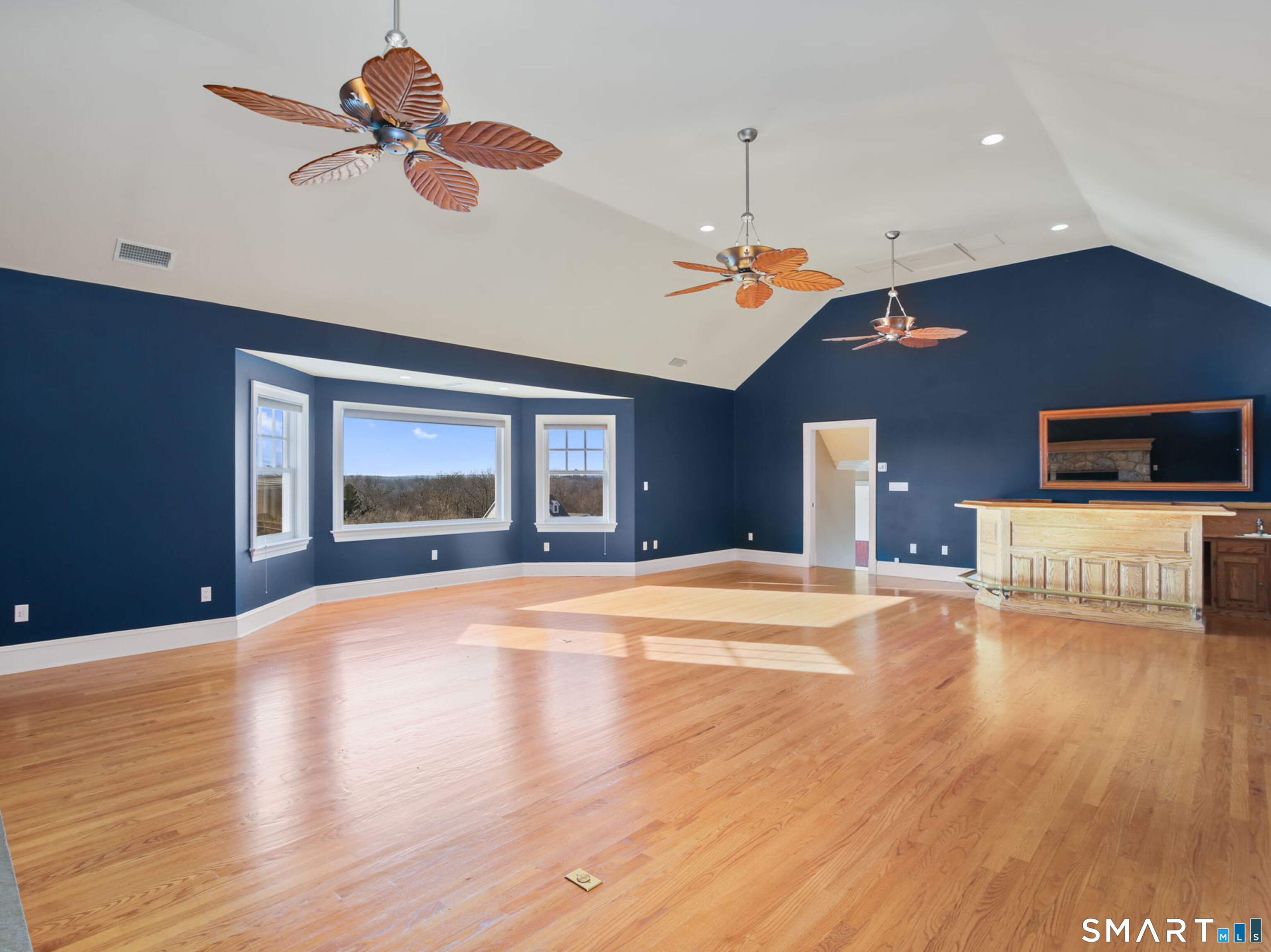 7 Long Meadow Lane Redding, CT 06896 - Photo 21 of 38 a view of an empty room with a window and kitchen view
