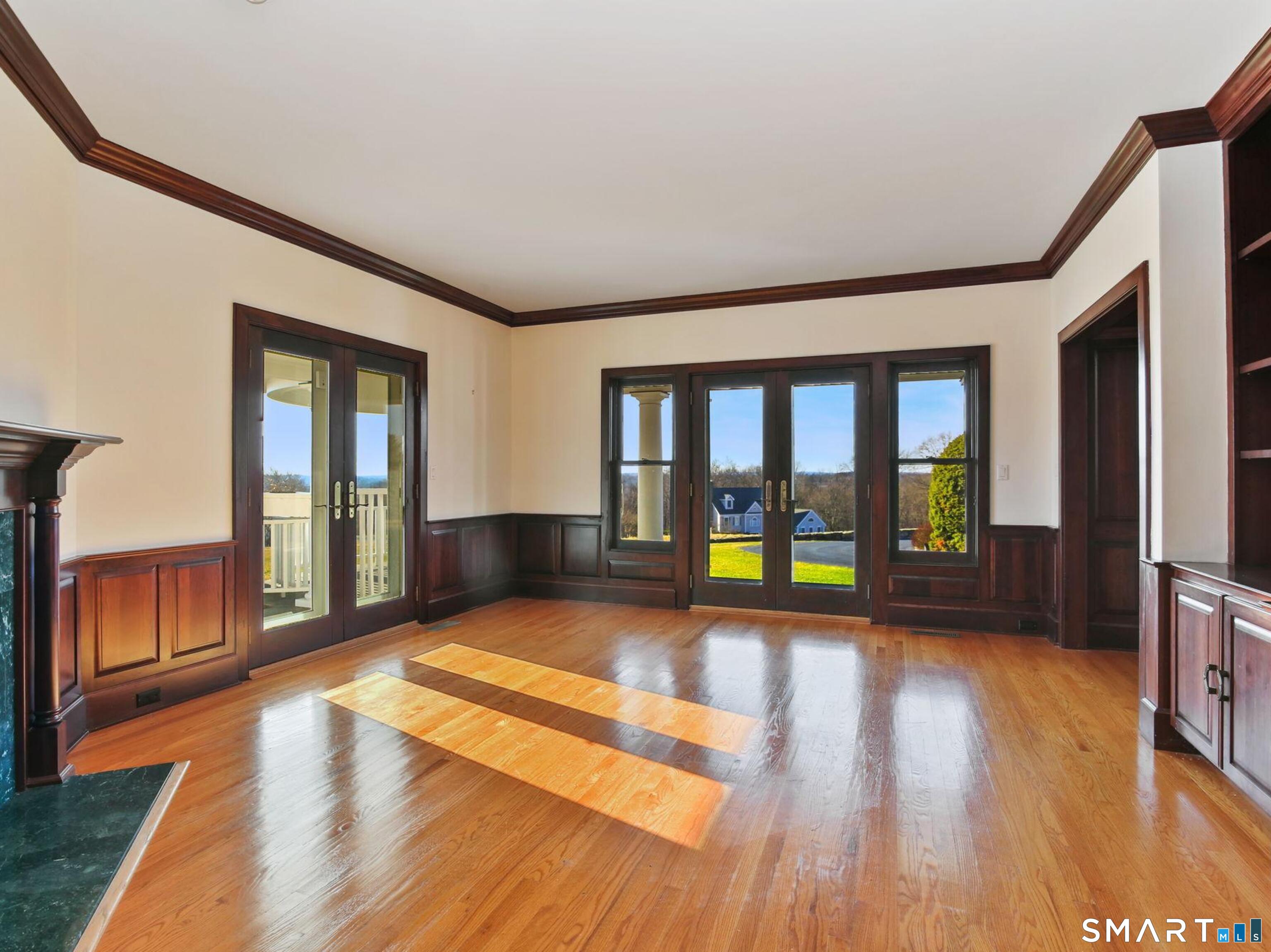 7 Long Meadow Lane Redding, CT 06896 - Photo 27 of 38 Light-filled workspace with custom built-ins and hardwood floors