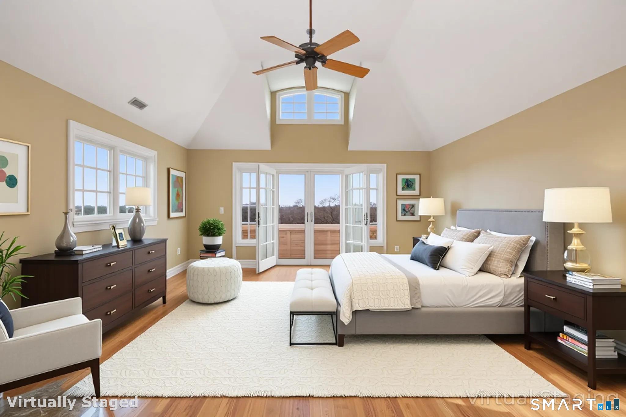 7 Long Meadow Lane Redding, CT 06896 - Photo 27 of 38 a spacious bedroom with a bed and a chandelier