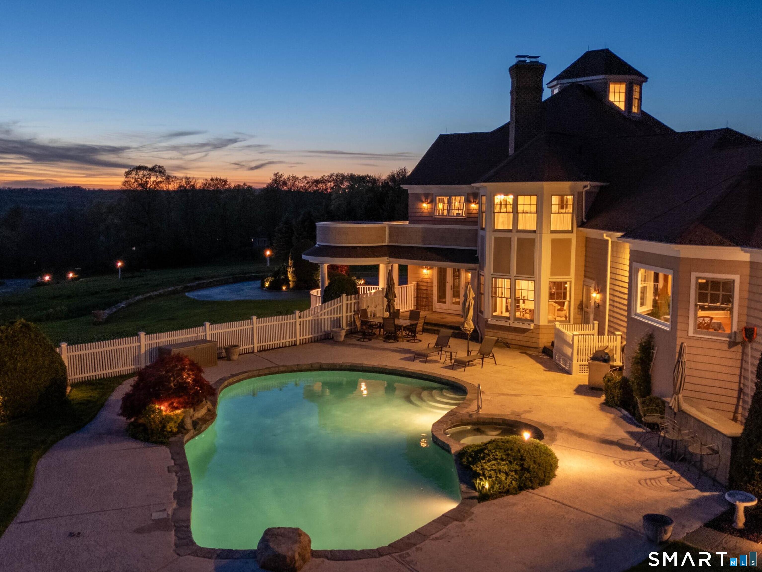 7 Long Meadow Lane Redding, CT 06896 - Photo 5 of 38 a view of a swimming pool with seating space