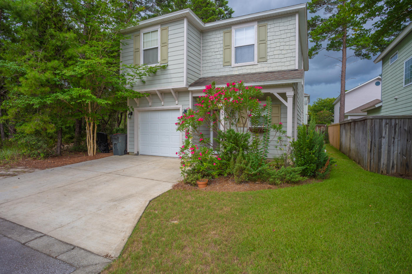 40 Myrtle Oak Way Santa Rosa Beach, FL 32459 - Photo 2 of 42 a front view of a house with garden