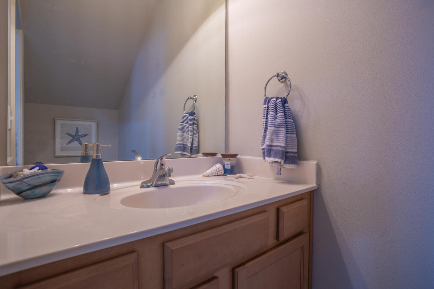 40 Myrtle Oak Way Santa Rosa Beach, FL 32459 - Photo 21 of 42 a bathroom with a sink and a mirror