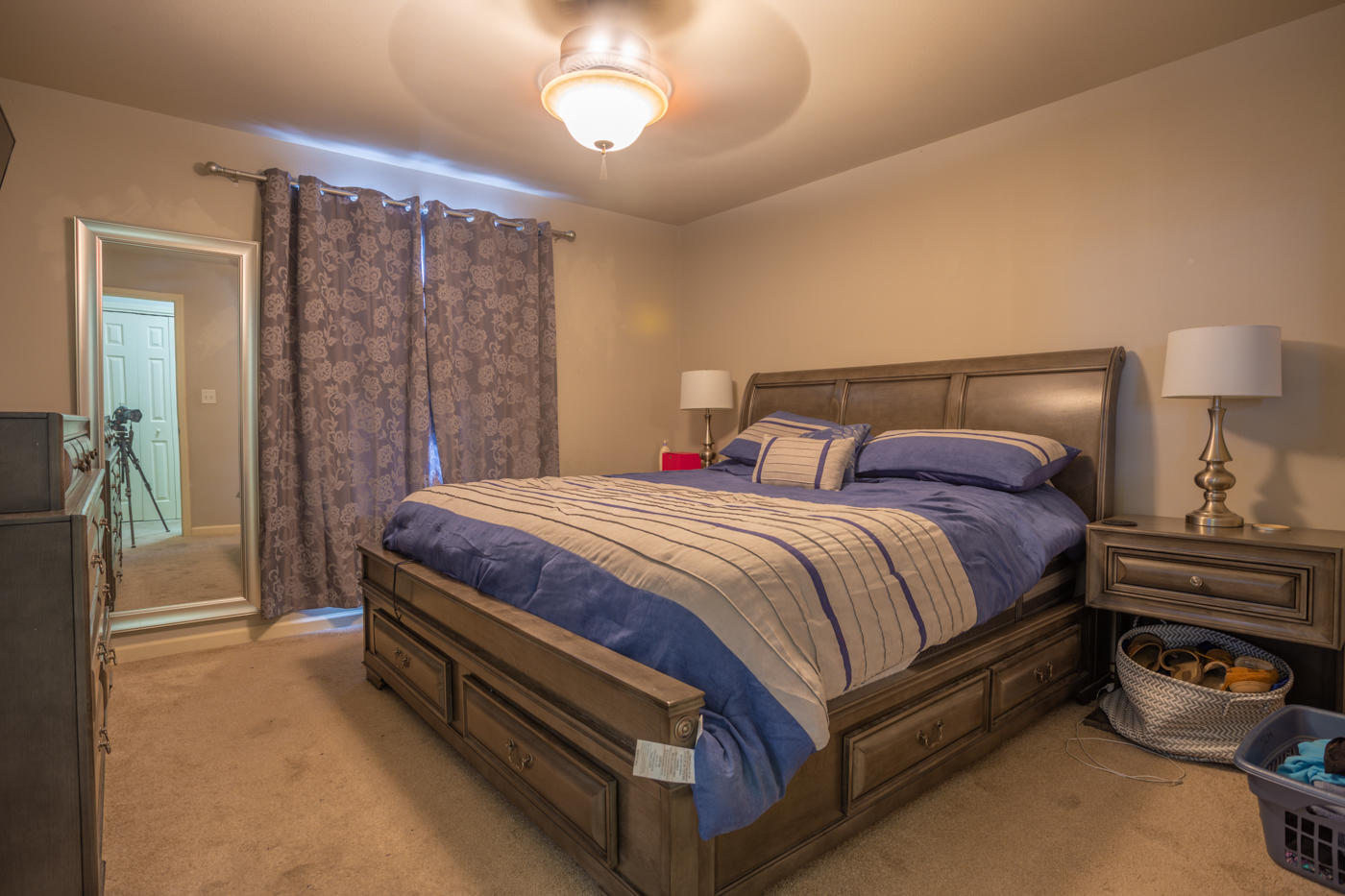 40 Myrtle Oak Way Santa Rosa Beach, FL 32459 - Photo 33 of 42 a spacious bedroom with a bed and a chandelier