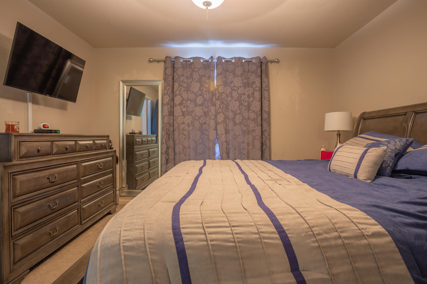 40 Myrtle Oak Way Santa Rosa Beach, FL 32459 - Photo 34 of 42 a bedroom with a bed and a flat screen tv