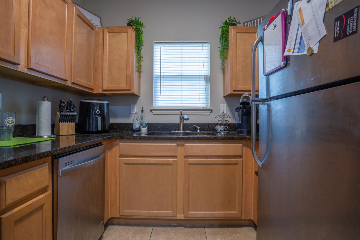 40 Myrtle Oak Way Santa Rosa Beach, FL 32459 - Photo 4 of 42 a kitchen with stainless steel appliances granite countertop a sink a refrigerator and a granite counter tops