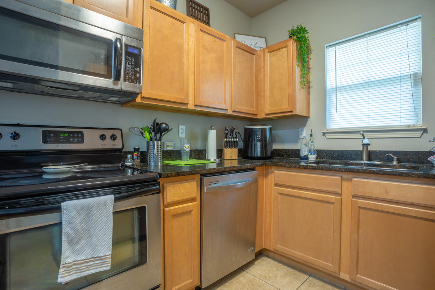 40 Myrtle Oak Way Santa Rosa Beach, FL 32459 - Photo 5 of 42 a kitchen with stainless steel appliances granite countertop a sink and a stove