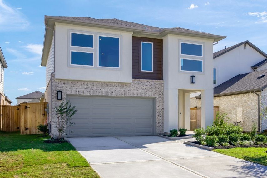 22122 Strathfield Circle Cypress, TX 77433 - Photo 1 of 38 a front view of a house with garden