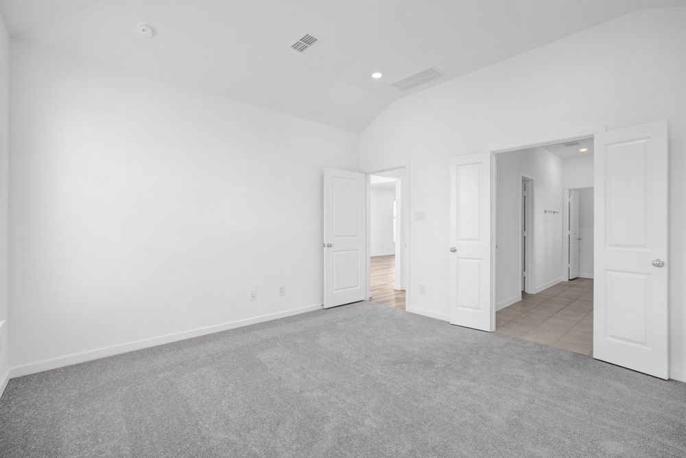 22122 Strathfield Circle Cypress, TX 77433 - Photo 12 of 38 an empty room with an entryway