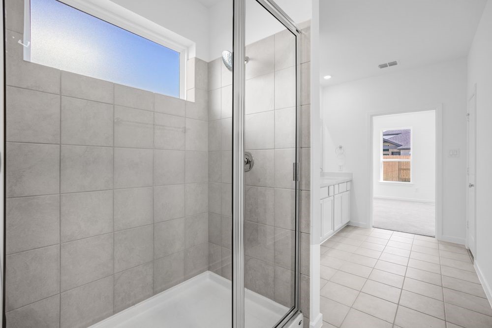 22122 Strathfield Circle Cypress, TX 77433 - Photo 13 of 38 a bathroom with a shower