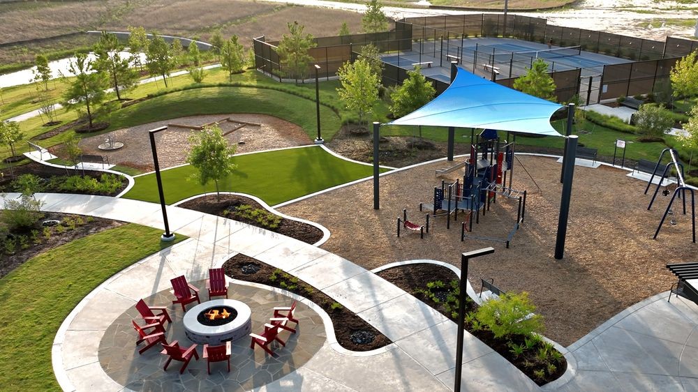 22122 Strathfield Circle Cypress, TX 77433 - Photo 35 of 38 an aerial view of a dinning table and chairs under an umbrella