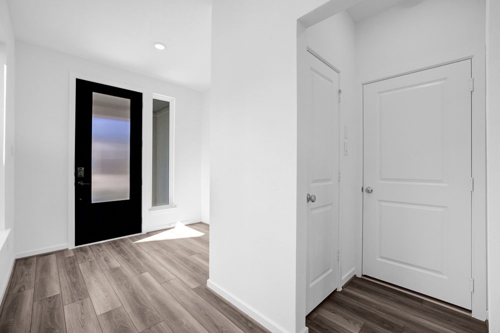 22122 Strathfield Circle Cypress, TX 77433 - Photo 10 of 38 a view of an empty room with wooden floor