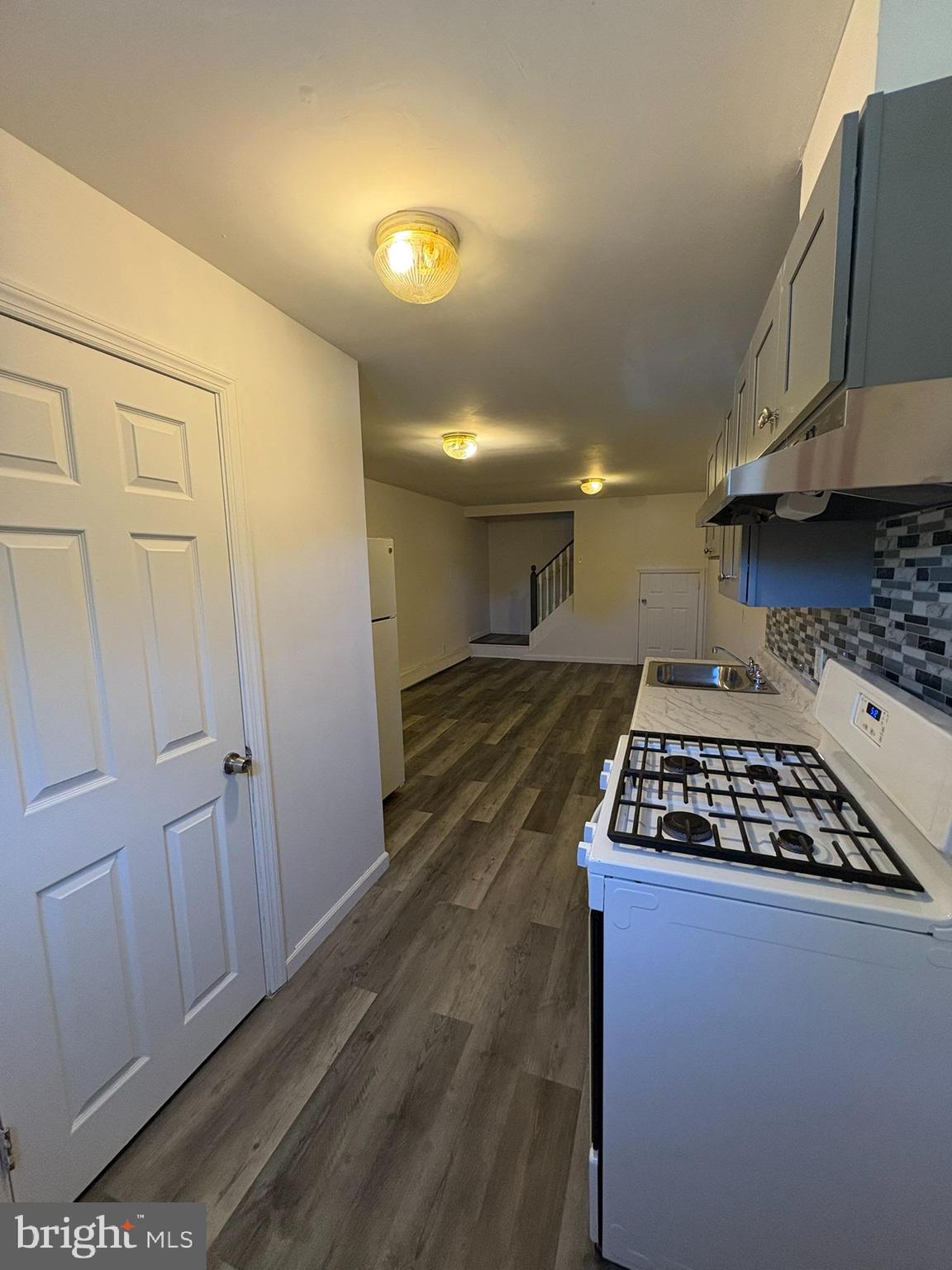 38 Broadway, Unit D Laurel Springs, NJ 08021 - Photo 1 of 21 a kitchen with granite countertop a stove and a refrigerator