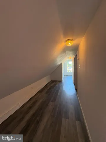 a view of gallery with wooden floor