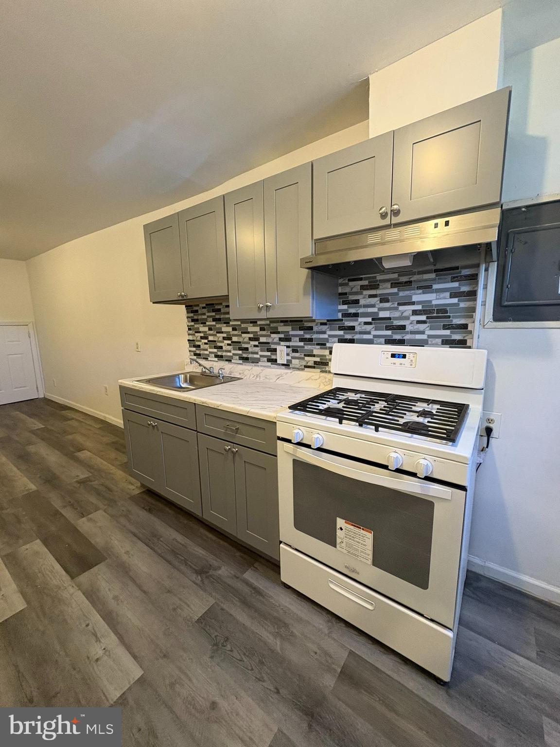 38 Broadway, Unit D Laurel Springs, NJ 08021 - Photo 3 of 21 a kitchen with a stove and a sink
