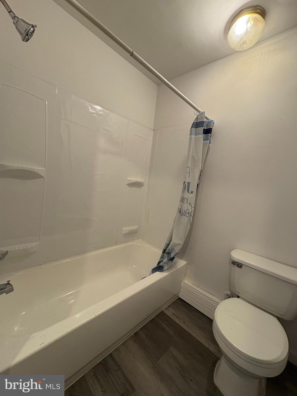 38 Broadway, Unit D Laurel Springs, NJ 08021 - Photo 4 of 21 a white toilet sitting next to a bath tub