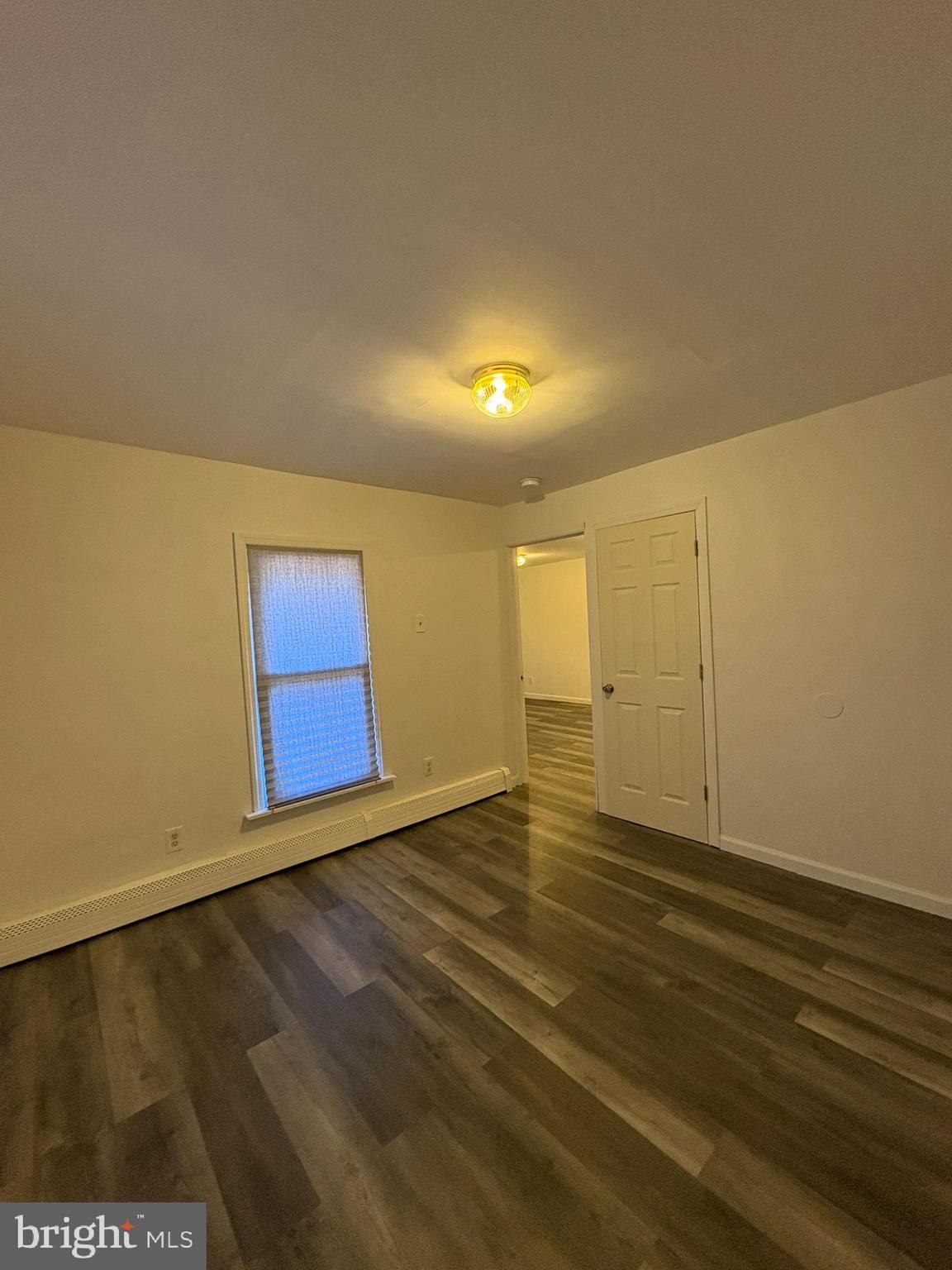 38 Broadway, Unit D Laurel Springs, NJ 08021 - Photo 8 of 21 a view of an empty room with wooden floor
