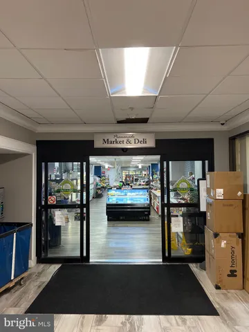 a view of a room with furniture and windows