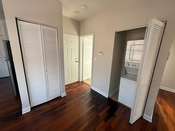 a view of hallway with wooden floor