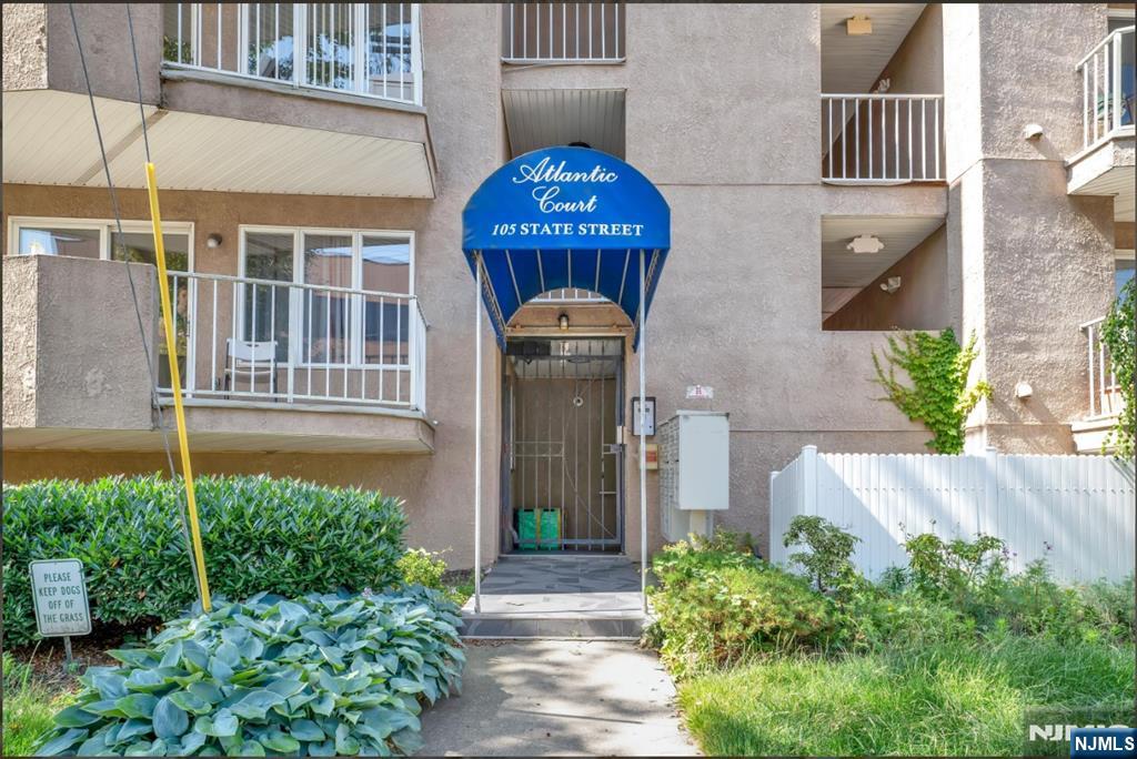 105 State Street, Unit 1B Hackensack, NJ 07601 - Photo 3 of 22 a front view of a house with a garden